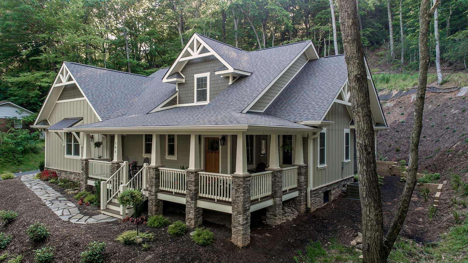 For home builders 26 A large green North Carolina home built by Scroggs Construction is surrounded by trees