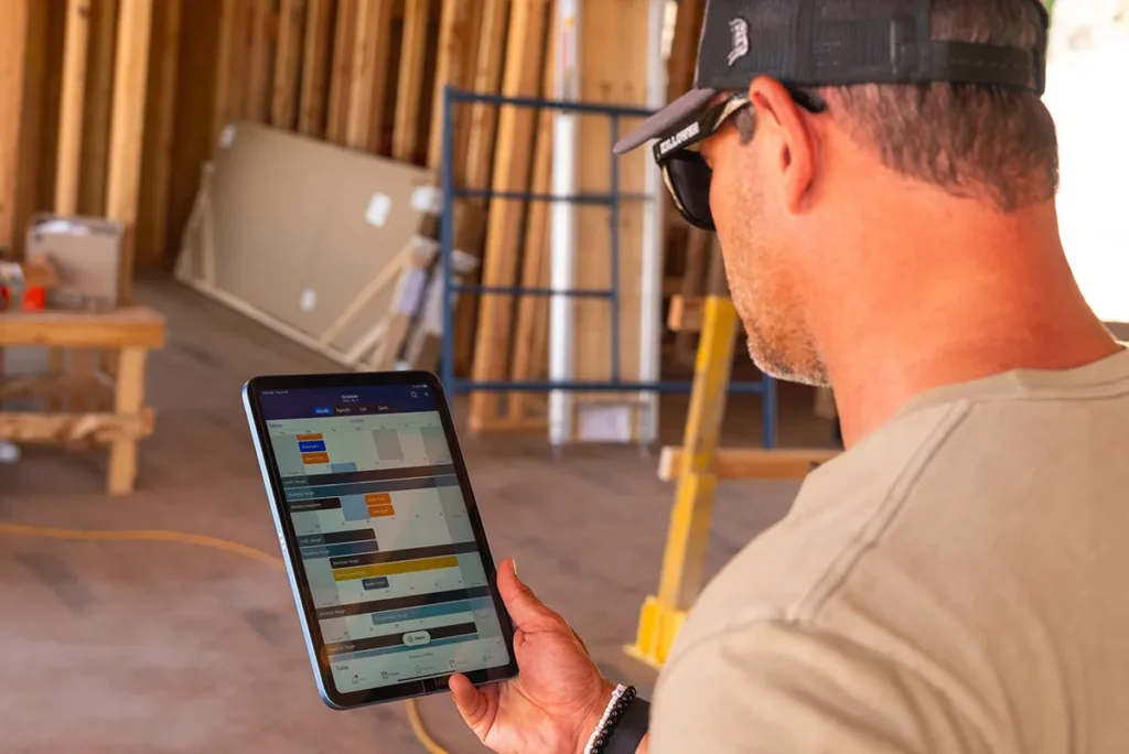 For home builders 1 Zoomed in photo of man looking at a tablet